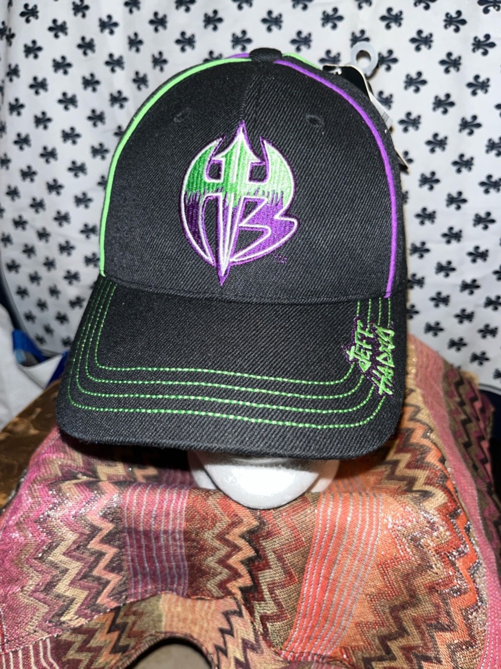 Black Hat with Green & Purple Embroidered Logo